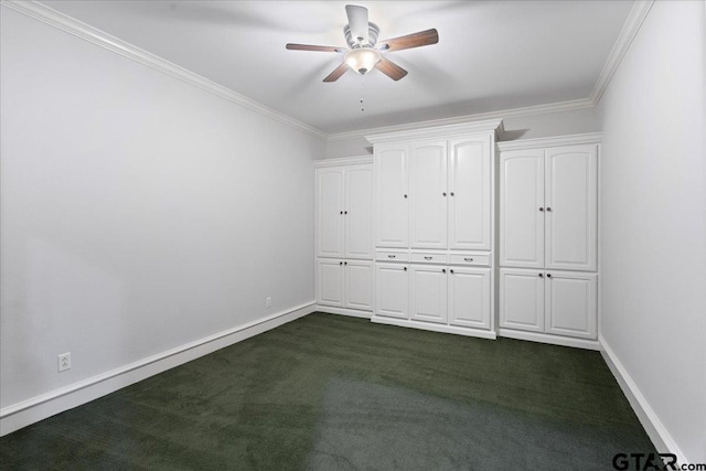 unfurnished bedroom with a closet, dark carpet, ceiling fan, and crown molding