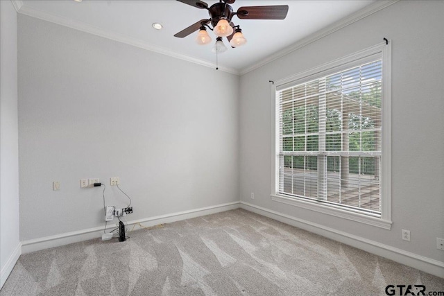 carpeted empty room with ornamental molding and ceiling fan