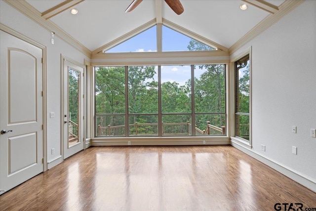 unfurnished sunroom with plenty of natural light, lofted ceiling, and ceiling fan