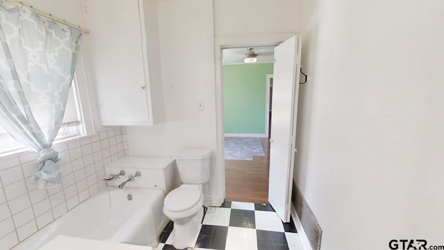 280 Dickard St, Hawkins, TX 75765 - bathroom featuring tile patterned floors, toilet, visible vents, and a washtub