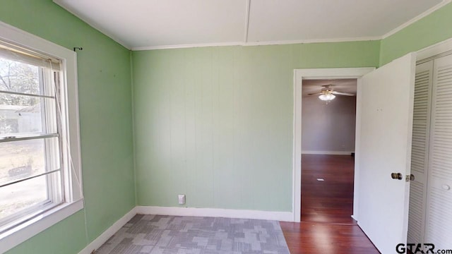 280 Dickard St, Hawkins, TX 75765 - empty room featuring ornamental molding, wood finished floors, baseboards, and ceiling fan