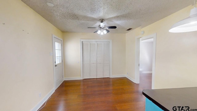 280 Dickard St, Hawkins, TX 75765 - interior space featuring a textured ceiling, wood finished floors, baseboards, and ceiling fan