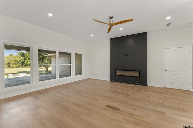 1036 High Meadow Dr, Mount Vernon, TX 75457 - unfurnished living room featuring ceiling fan, light wood-type flooring, recessed lighting, a fireplace, and baseboards