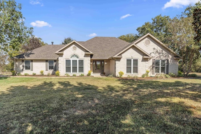 1036 High Meadow Dr, Mount Vernon, TX 75457 - ranch-style house with brick siding, a front lawn, and roof with shingles