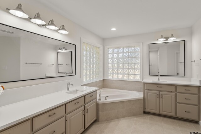 1036 High Meadow Dr, Mount Vernon, TX 75457 - full bath with a bath, two vanities, tile patterned flooring, and recessed lighting