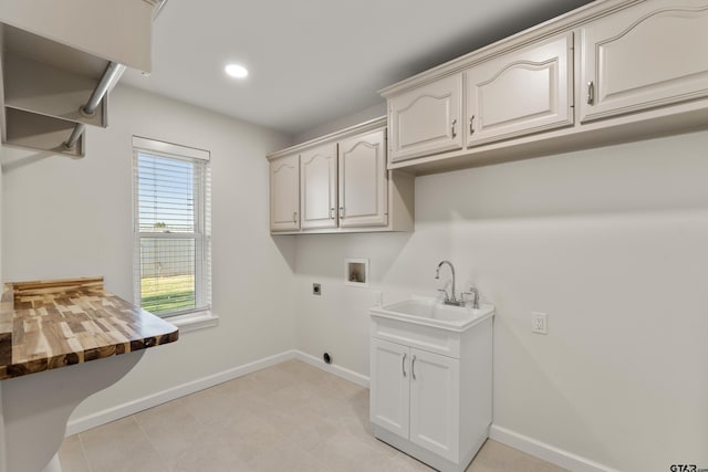 1036 High Meadow Dr, Mount Vernon, TX 75457 - clothes washing area featuring electric dryer hookup, hookup for a washing machine, baseboards, recessed lighting, and cabinet space