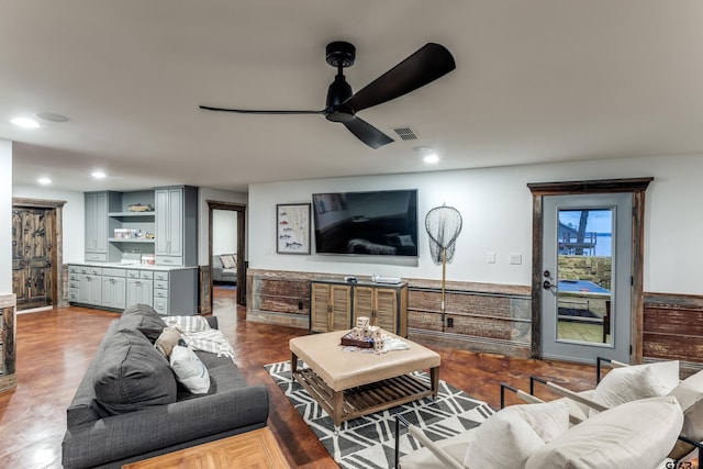 living area featuring visible vents, recessed lighting, and a ceiling fan