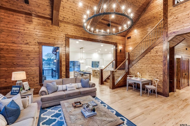 living area featuring wood ceiling, high vaulted ceiling, stairs, and wood finished floors