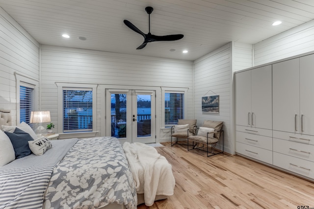 bedroom with recessed lighting, french doors, access to exterior, and light wood finished floors