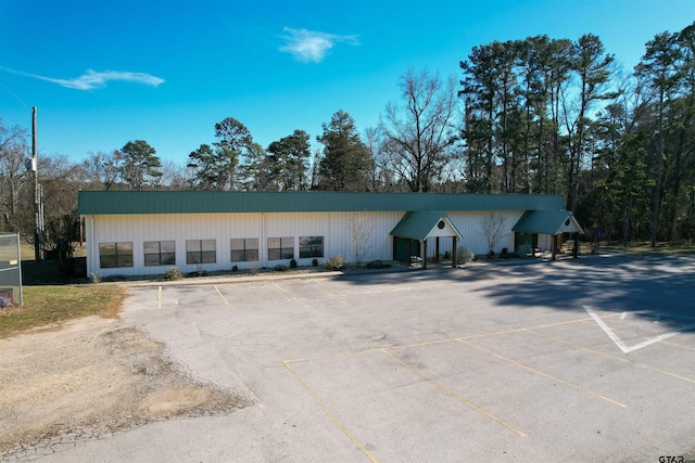 view of property with uncovered parking