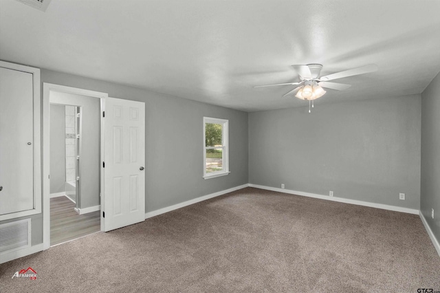 carpeted empty room with ceiling fan