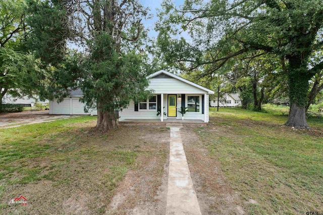 view of front facade with a garage and a front lawn