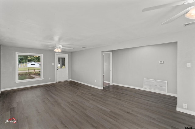 unfurnished living room with ceiling fan and dark hardwood / wood-style floors