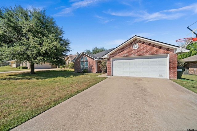 view of front of property with a garage and a front lawn