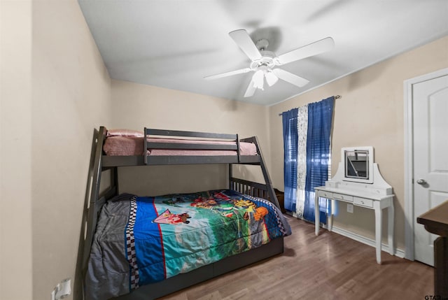 bedroom with ceiling fan and hardwood / wood-style flooring