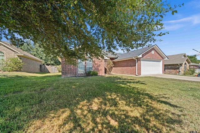 single story home featuring a garage and a front yard