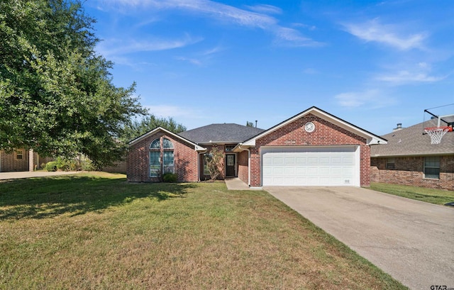 ranch-style house featuring a front yard and a garage