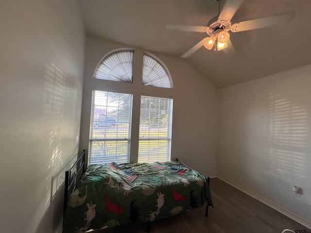 bedroom featuring ceiling fan, hardwood / wood-style floors, and lofted ceiling