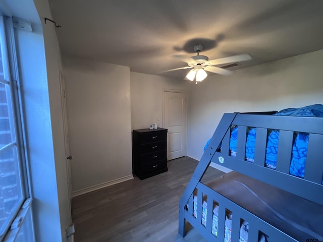 bedroom with ceiling fan and hardwood / wood-style flooring