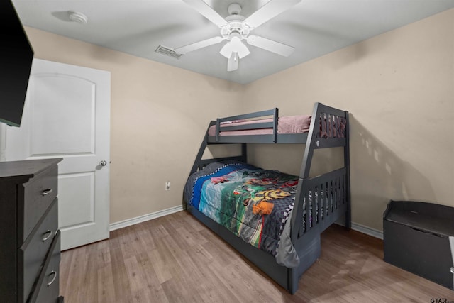 bedroom with ceiling fan and light hardwood / wood-style floors