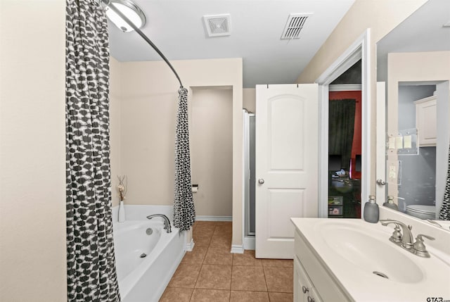 full bathroom with tile patterned flooring, vanity, toilet, and separate shower and tub