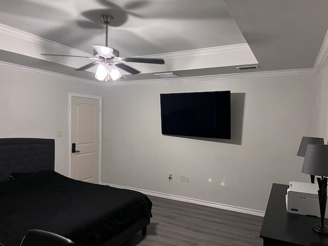 bedroom featuring ceiling fan, dark hardwood / wood-style flooring, and ornamental molding