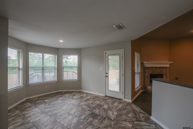 5878 Palo Pinto Dr, Tyler, TX 75707 - unfurnished dining area featuring plenty of natural light, a premium fireplace, and recessed lighting