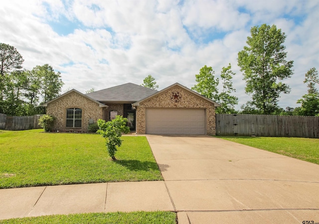 ranch-style home featuring fence, a front yard, brick siding, an attached garage, and driveway