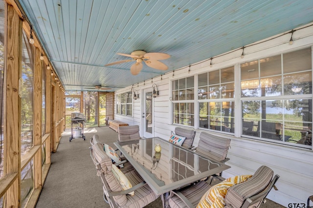 exterior space with wood ceiling and ceiling fan