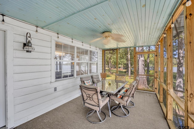 sunroom with ceiling fan and wood ceiling