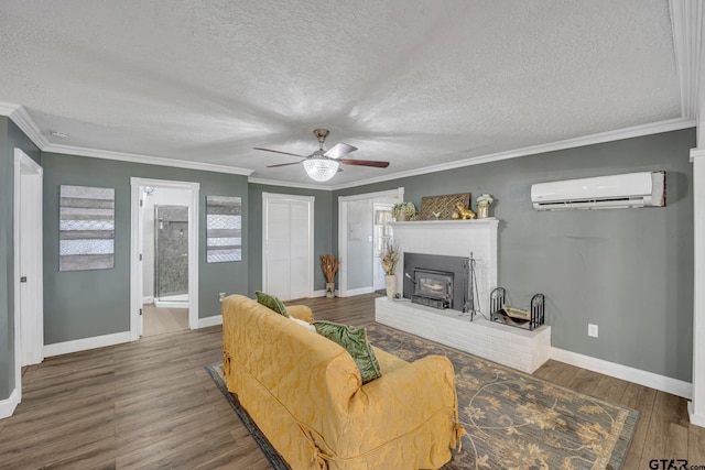 living room with crown molding, dark wood-type flooring, a wall mounted air conditioner, and a textured ceiling