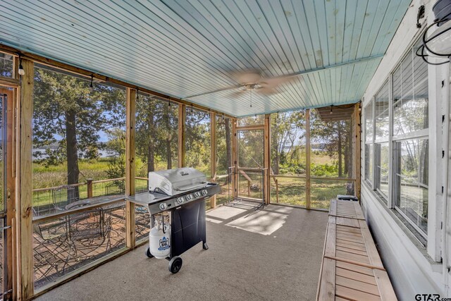 sunroom / solarium featuring wooden ceiling