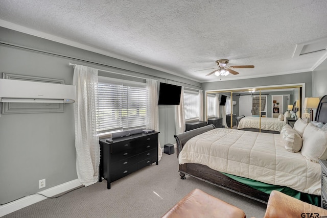 carpeted bedroom featuring ceiling fan and a textured ceiling