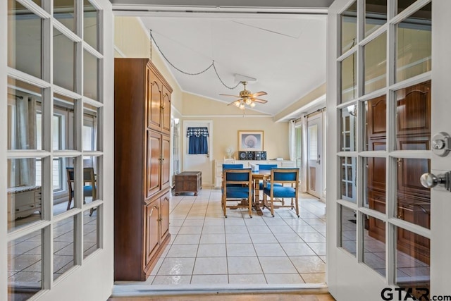 tiled office space with ceiling fan and lofted ceiling