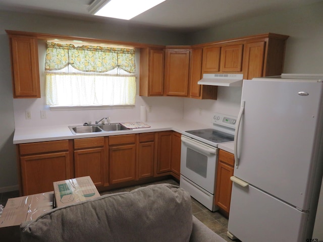 kitchen featuring tile patterned floors, sink, and white appliances