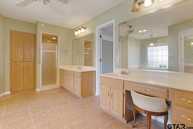 bathroom featuring ceiling fan, tile patterned flooring, vanity, and walk in shower