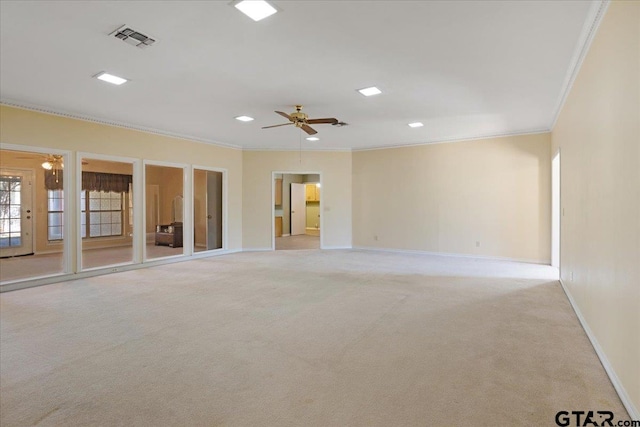 empty room with light colored carpet, ceiling fan, and crown molding