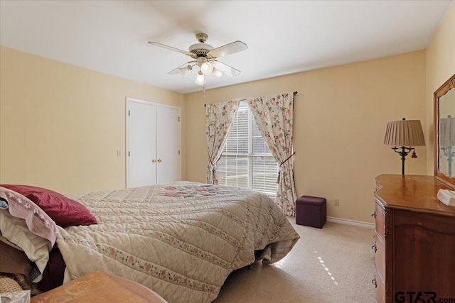 bedroom with light carpet and ceiling fan