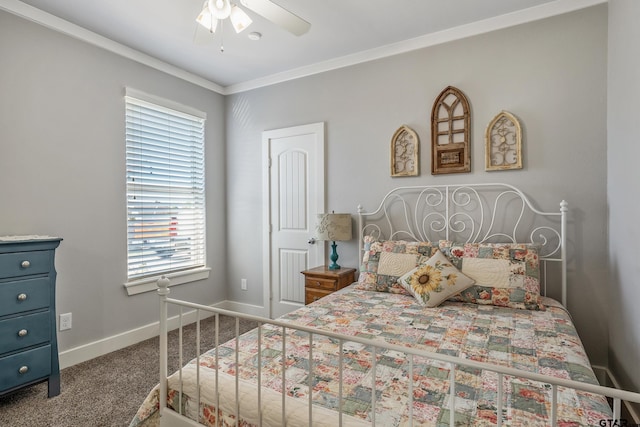 carpeted bedroom featuring crown molding and ceiling fan