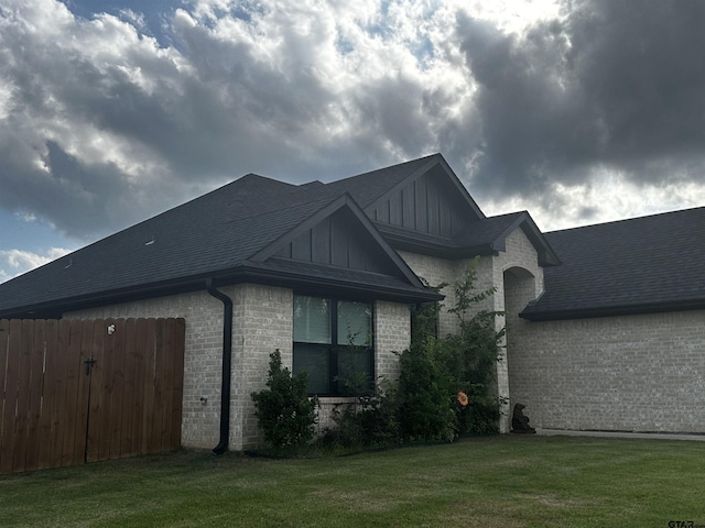 19135 Ambrosia Dr, Flint, TX 75762 - view of side of property with brick siding, board and batten siding, and roof with shingles