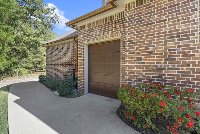 view of exterior entry with a garage