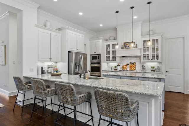 kitchen with white cabinetry, backsplash, appliances with stainless steel finishes, and dark wood-type flooring