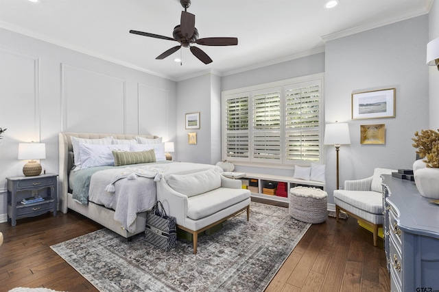 bedroom with dark hardwood / wood-style floors, ceiling fan, and crown molding