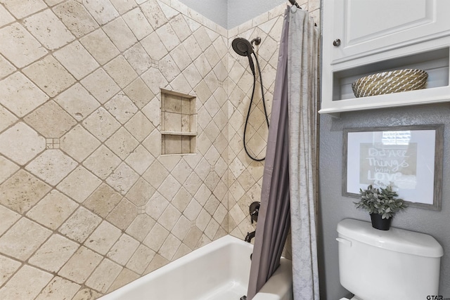 bathroom featuring toilet and shower / bath combo with shower curtain