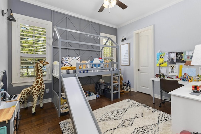 bedroom featuring ceiling fan, dark hardwood / wood-style floors, and ornamental molding