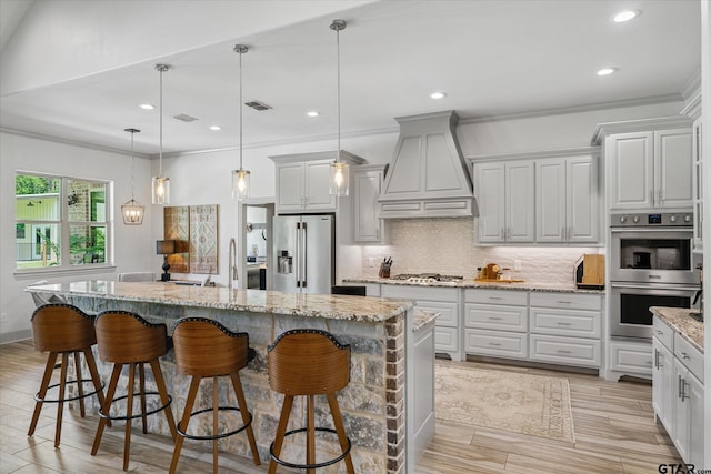 185 Vz County Road 2103, Canton, TX 75103 - kitchen featuring custom range hood, stainless steel appliances, backsplash, a kitchen bar, and a kitchen island