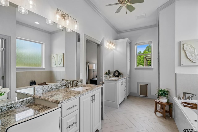 185 Vz County Road 2103, Canton, TX 75103 - bathroom with a soaking tub, two vanities, a ceiling fan, and crown molding