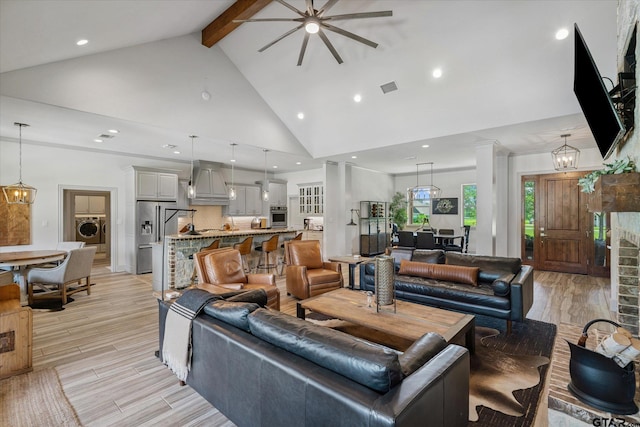 185 Vz County Road 2103, Canton, TX 75103 - living area featuring washer / dryer, high vaulted ceiling, a ceiling fan, beam ceiling, and light wood-style flooring