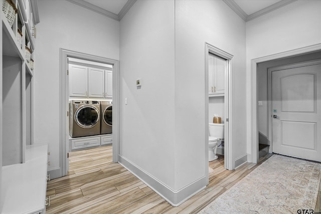 185 Vz County Road 2103, Canton, TX 75103 - laundry room featuring ornamental molding, washing machine and dryer, light wood finished floors, and cabinet space