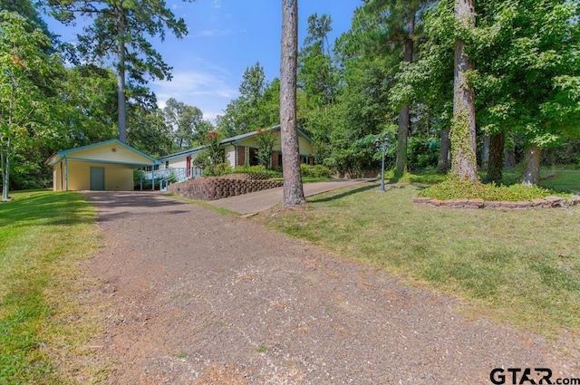 1656 Pineview Ln, Hideaway, TX 75771 - view of front of home with gravel driveway and a front lawn